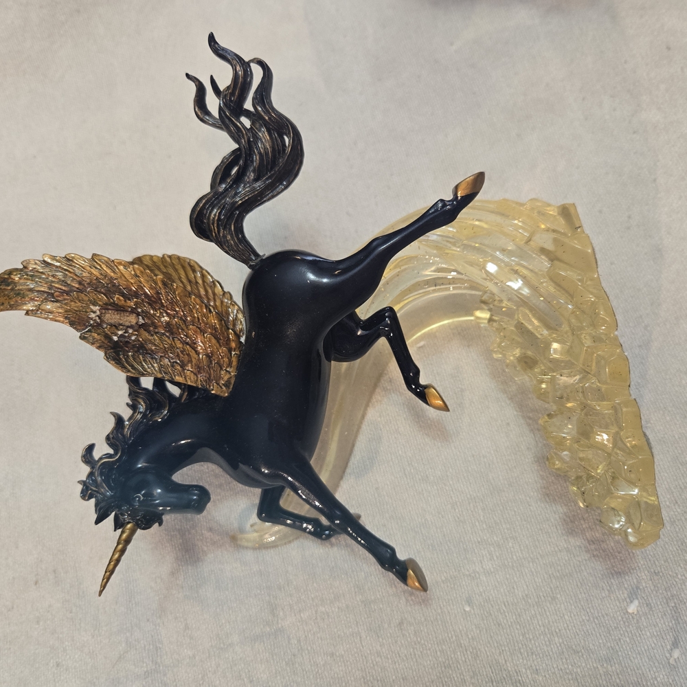 Dynamic Black and Gold Mythical Creature Sculpture